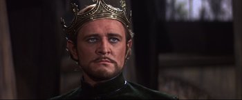Movie still from “Camelot” (1967), directed by Joshua Logan – A person wearing a crown; Close Up shot, Low angle