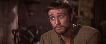 Movie still from “Camelot” (1967), directed by Joshua Logan – A person with a beard; Close Up shot, Over the shoulder angle