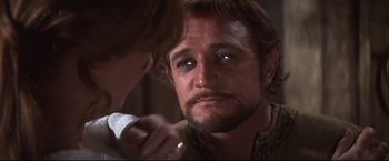 Movie still from “Camelot” (1967), directed by Joshua Logan – A person looking at a mirror; Close Up shot, Over the shoulder angle