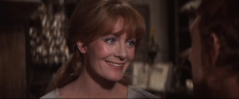 Movie still from “Camelot” (1967), directed by Joshua Logan – A person with a smile on their face; Close Up shot, Over the shoulder angle