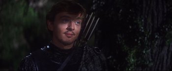 Movie still from “Camelot” (1967), directed by Joshua Logan – A person with a bow and arrow; Close Up shot, Over the shoulder angle