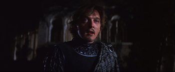 Movie still from “Camelot” (1967), directed by Joshua Logan – A person wearing a suit of armor; Close Up shot, Low angle
