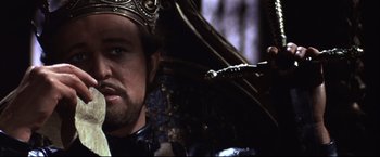 Movie still from “Camelot” (1967), directed by Joshua Logan – A person wearing a crown; Close Up shot, Over the shoulder angle