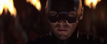 Movie still from “Camelot” (1967), directed by Joshua Logan – A person wearing a mask; Close Up shot, Low angle