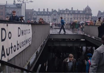 Movie still from “Camera Buff” (1979), directed by Krzysztof Kieslowski – A group of people standing on top of a train platform; Extreme Wide shot, High angle