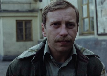 Movie still from “Camera Buff” (1979), directed by Krzysztof Kieslowski – A person with a mustache; Close Up shot, Low angle