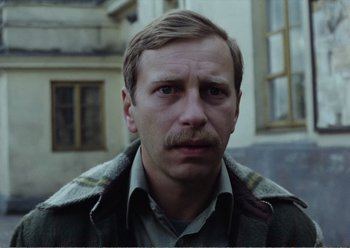 Movie still from “Camera Buff” (1979), directed by Krzysztof Kieslowski – A person with a mustache; Close Up shot, Low angle