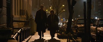 Movie still from “Can You Ever Forgive Me?” (2018), directed by Marielle Heller – Two people walking down a sidewalk at night; Wide shot, Over the shoulder angle