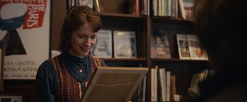 Movie still from “Can You Ever Forgive Me?” (2018), directed by Marielle Heller – A woman is reading a book in a library; Close Up shot, Over the shoulder angle