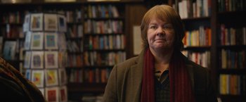 Movie still from “Can You Ever Forgive Me?” (2018), directed by Marielle Heller – An older woman wearing a jacket and a red scarf; Close Up shot, Over the shoulder angle