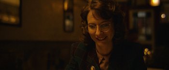 Movie still from “Can You Ever Forgive Me?” (2018), directed by Marielle Heller – A woman wearing glasses sitting in a room; Close Up shot, Over the shoulder angle