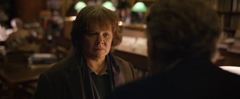 Movie still from “Can You Ever Forgive Me?” (2018), directed by Marielle Heller – An older woman is looking at a man; Close Up shot, Over the shoulder angle
