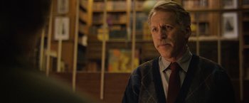 Movie still from “Can You Ever Forgive Me?” (2018), directed by Marielle Heller – An older man with a mustache wearing a sweater and a tie; Close Up shot, Low angle