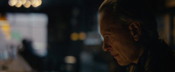 Movie still from “Can You Ever Forgive Me?” (2018), directed by Marielle Heller – A person's face at night time; Close Up shot, Over the shoulder angle