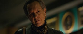 Movie still from “Can You Ever Forgive Me?” (2018), directed by Marielle Heller – An older man wearing a leather jacket looking at the camera; Close Up shot, Low angle