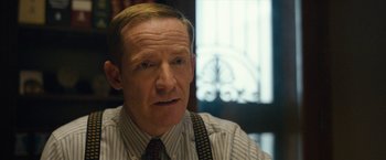 Movie still from “Can You Ever Forgive Me?” (2018), directed by Marielle Heller – A person wearing a shirt and a tie; Close Up shot, Over the shoulder angle