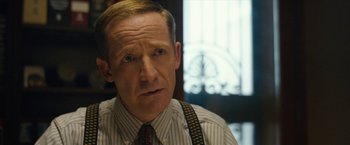 Movie still from “Can You Ever Forgive Me?” (2018), directed by Marielle Heller – A person wearing a shirt and a tie; Close Up shot, Over the shoulder angle