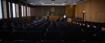 Movie still from “Can You Ever Forgive Me?” (2018), directed by Marielle Heller – A court room filled with people sitting in front of a judge; Extreme Wide shot, High angle