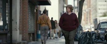 Movie still from “Can You Ever Forgive Me?” (2018), directed by Marielle Heller – A woman walking down a street with a crowd of people; Medium shot, Over the shoulder angle