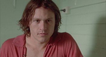 Movie still from “Candy” (2006), directed by Neil Armfield – A person with long brown hair; Close Up shot, High angle