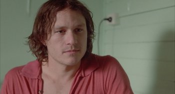 Movie still from “Candy” (2006), directed by Neil Armfield – A person with long brown hair; Close Up shot, High angle