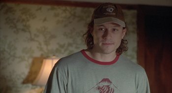 Movie still from “Candy” (2006), directed by Neil Armfield – A person wearing a hat; Close Up shot, Over the shoulder angle