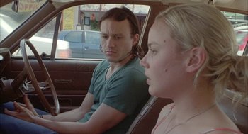 Movie still from “Candy” (2006), directed by Neil Armfield – A man and a woman sitting in the back of a car; Close Up shot, Over the shoulder angle