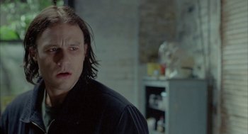 Movie still from “Candy” (2006), directed by Neil Armfield – A person with long hair; Close Up shot, Over the shoulder angle