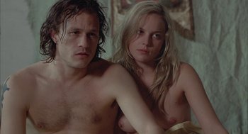 Movie still from “Candy” (2006), directed by Neil Armfield – A man and a woman sitting next to each other; Close Up shot, High angle