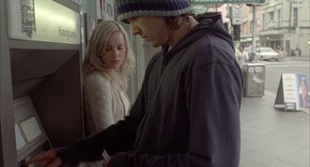 Movie still from “Candy” (2006), directed by Neil Armfield – A man and a woman on a train; Medium shot, Low angle