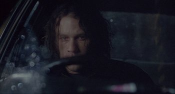 Movie still from “Candy” (2006), directed by Neil Armfield – A person with long hair in a car; Close Up shot, Over the shoulder angle