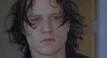 Movie still from “Candy” (2006), directed by Neil Armfield – A person with long black hair; Close Up shot, Low angle