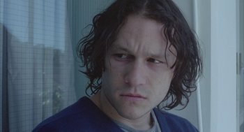 Movie still from “Candy” (2006), directed by Neil Armfield – A person with long black hair; Close Up shot, Low angle