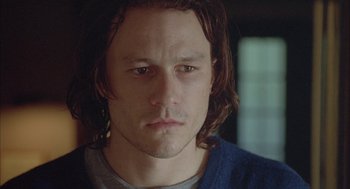 Movie still from “Candy” (2006), directed by Neil Armfield – A person with long brown hair; Close Up shot, High angle