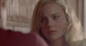 Movie still from “Candy” (2006), directed by Neil Armfield – A young blonde haired woman looking into a mirror; Close Up shot, Over the shoulder angle