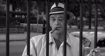 Movie still from “Cape Fear” (1962), directed by J. Lee Thompson – A black and white photo of a man smoking a cigarette; Close Up shot, Low angle