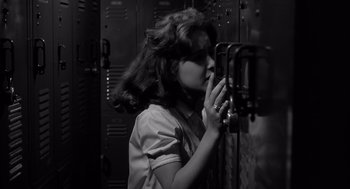 Movie still from “Cape Fear” (1962), directed by J. Lee Thompson – A woman taking a picture of herself in a mirror; Close Up shot, Low angle