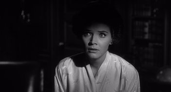 Movie still from “Cape Fear” (1962), directed by J. Lee Thompson – A black - and - white photo of a woman looking at the camera; Close Up shot, Low angle