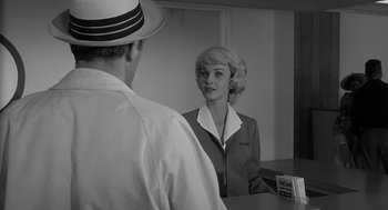 Movie still from “Cape Fear” (1962), directed by J. Lee Thompson – A man and a woman are looking at each other in the mirror; Medium shot, Over the shoulder angle