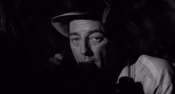 Movie still from “Cape Fear” (1962), directed by J. Lee Thompson – A black and white photo of a man in a hat; Close Up shot, Low angle