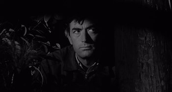 Movie still from “Cape Fear” (1962), directed by J. Lee Thompson – Black and white photograph of a man looking up; Close Up shot, Low angle