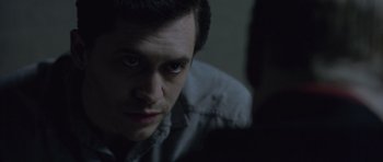 Movie still from “Capote” (2005), directed by Bennett Miller – A person looking at the camera; Close Up shot, Over the shoulder angle