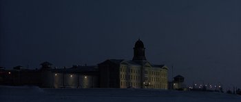 Movie still from “Capote” (2005), directed by Bennett Miller – A large building with a dome on the top of it; Extreme Wide shot, Low angle