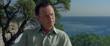 Movie still from “Capote” (2005), directed by Bennett Miller – A person near a body of water; Close Up shot, Low angle