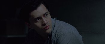 Movie still from “Capote” (2005), directed by Bennett Miller – A person sitting in a dark room; Close Up shot, High angle