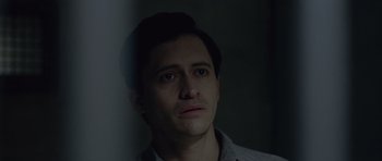 Movie still from “Capote” (2005), directed by Bennett Miller – A person wearing a gray shirt; Close Up shot, Low angle