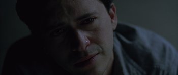 Movie still from “Capote” (2005), directed by Bennett Miller – A man's face as he looks into the distance; Close Up shot, High angle