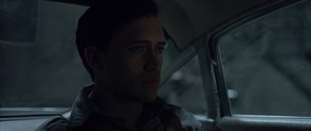 Movie still from “Capote” (2005), directed by Bennett Miller – A person sitting in a car; Close Up shot, Over the shoulder angle