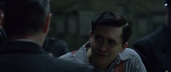 Movie still from “Capote” (2005), directed by Bennett Miller – A person wearing a jacket; Close Up shot, Over the shoulder angle