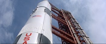 Movie still from “Capricorn One” (1977), directed by Peter Hyams – A rocket is shown from the ground up; Extreme Wide shot, Low angle
